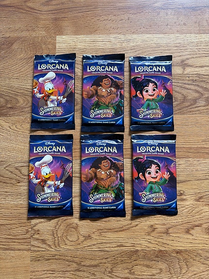 Disney Lorcana Shimmering Skies booster pakker trading cards